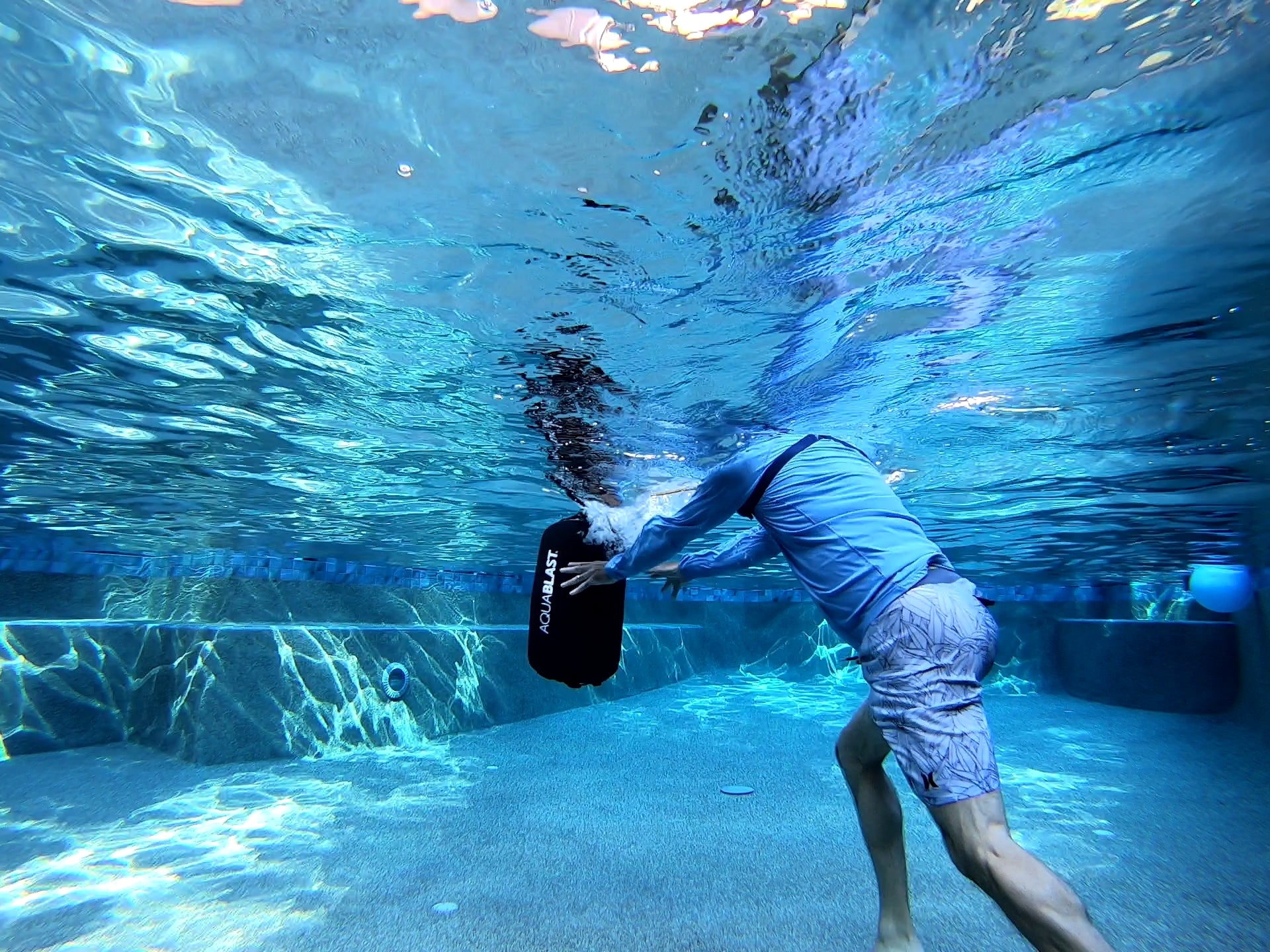 Throwing AquaBLAST in your swimming pool is just like pushing a medicine ball, except it glides underwater.