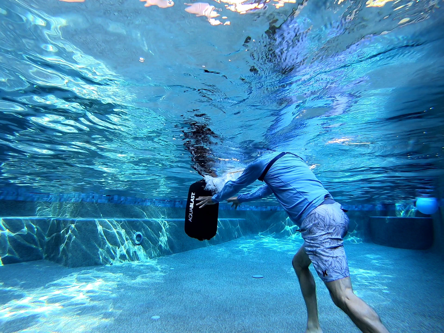 Push the Aqua BLAST punching bag in swimming pools for Aqua Fitness, Water Aerobics, Hydro Workouts, and Kickboxing